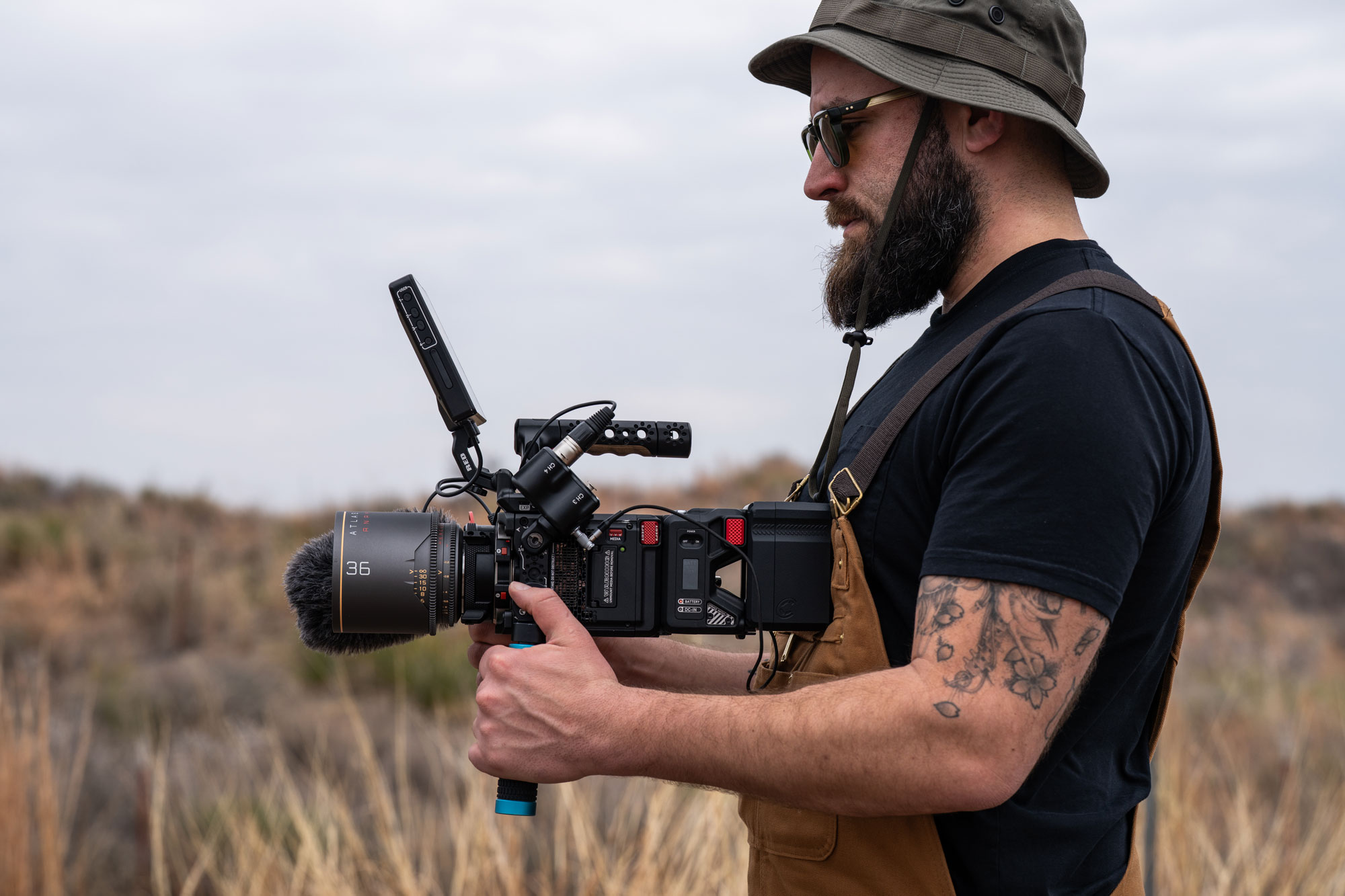 Stephen Brucher filming on location with a cinema camera